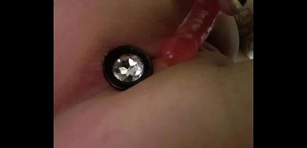  Shy girl puts a butt plug in and makes herself cum